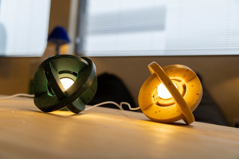 Spherical lamps placed on a wooden surface. 